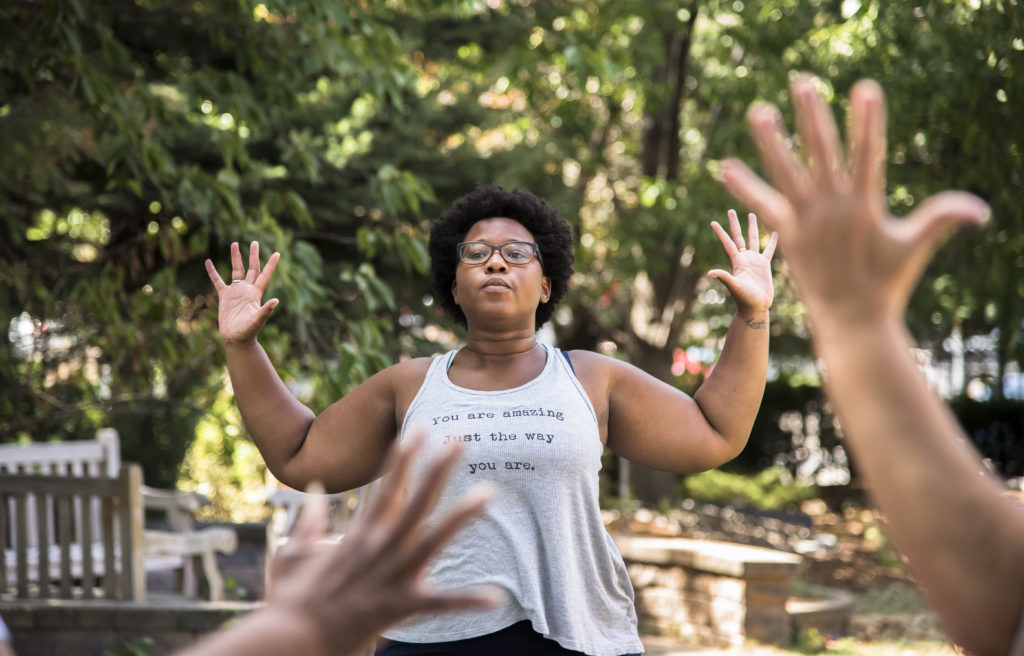 Yoga instructor Theresa Okokon teaching her last class at Rosies Place August 30, 2016